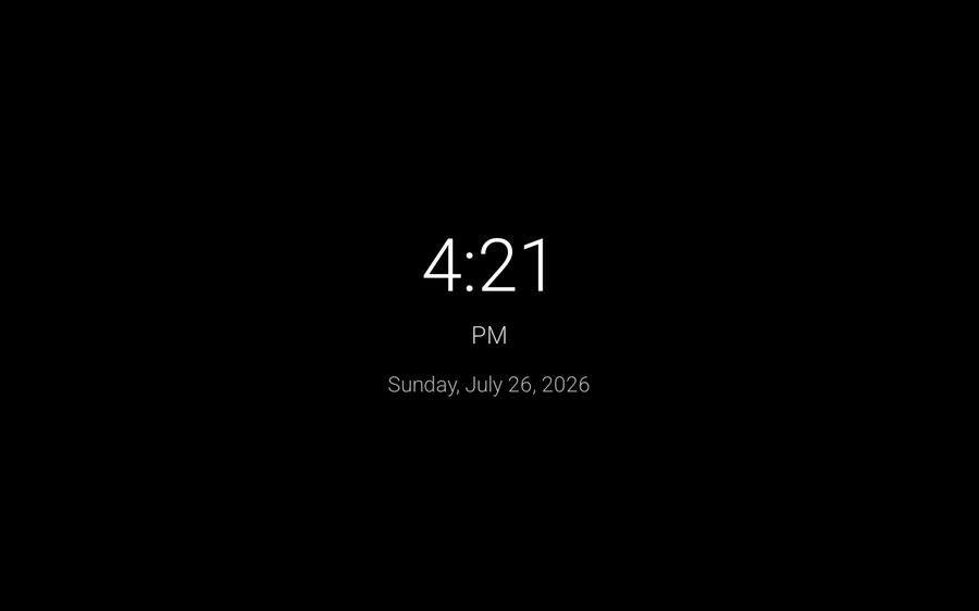 Clock mode showing a large clock and the date on a black screen